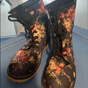 Boots - black denim look background with floral print.